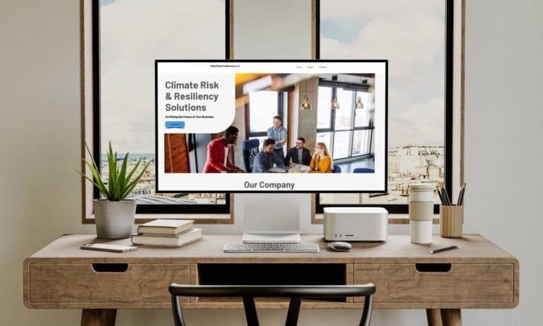 Desktop mockup of Phil Michele website shown in a modern workspace setting, highlighting the homepage design with clear service messaging, friendly imagery, and a soft, welcoming color palette.